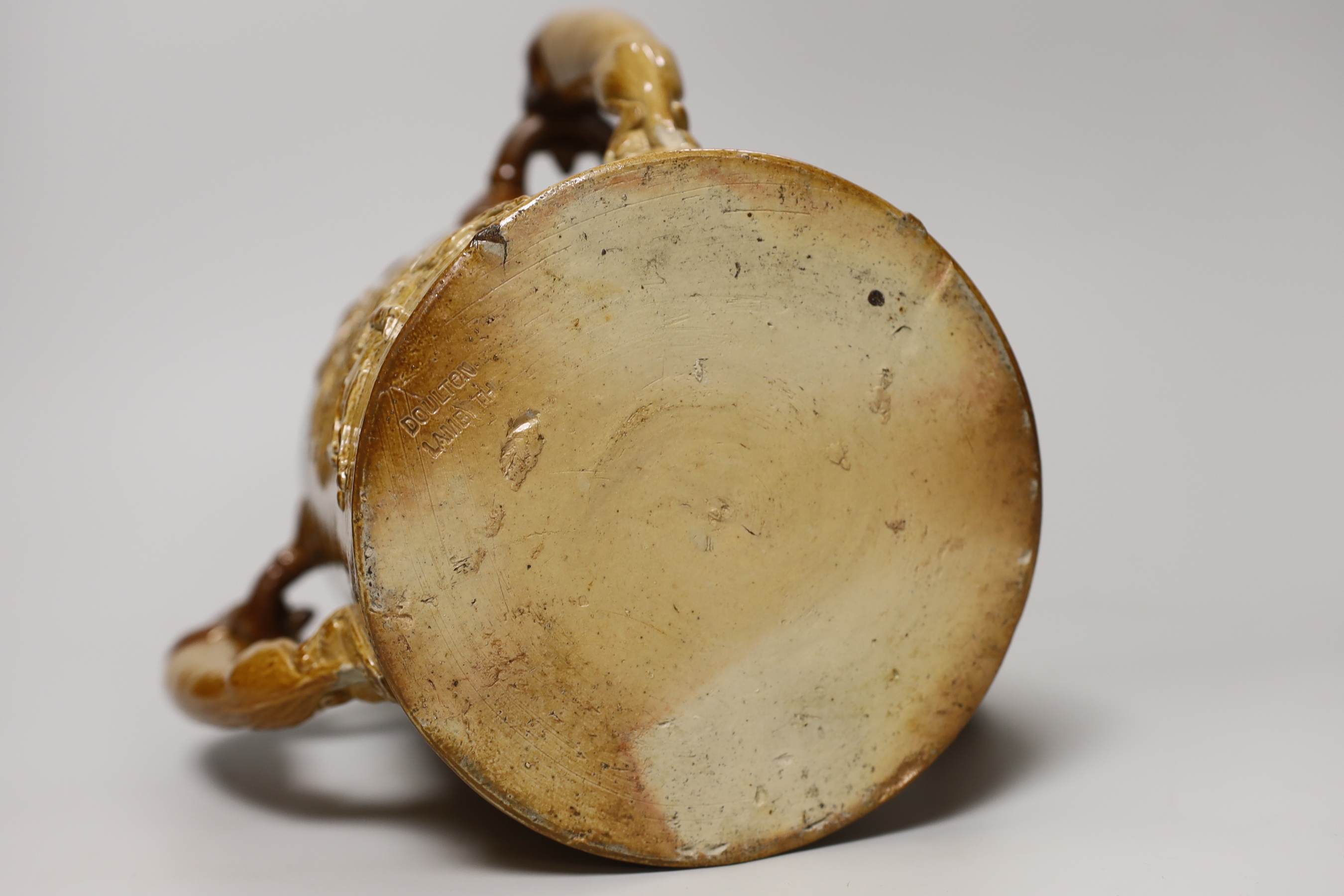 A Doulton Lambeth stoneware three handled tyg with silver collar, hallmarked London 1885, 18cm high